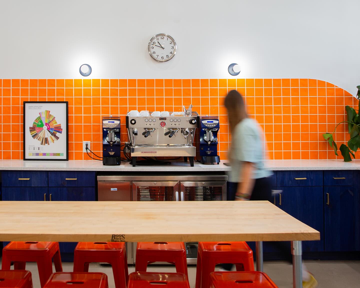 Counter Culture Coffee Training Center interior with orange tile backsplash and blue millwork